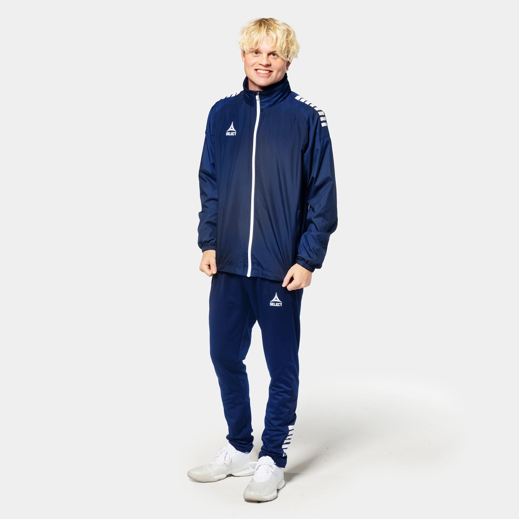 Man in navy Training jacket Spain v25, Match & Training wear, with white details, front view