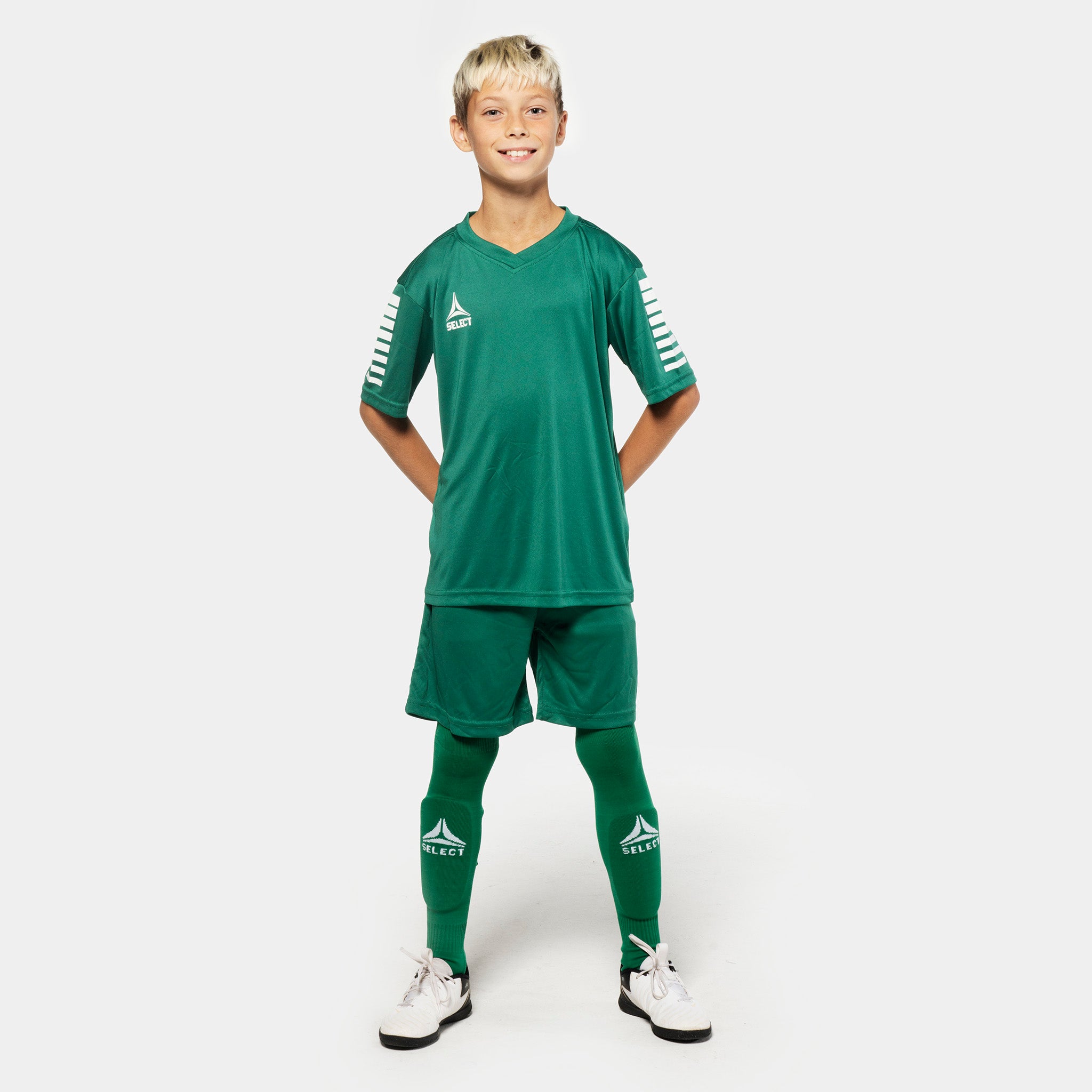 Boy football player wearing green Player shorts Pisa from Match & Training wear, front view.