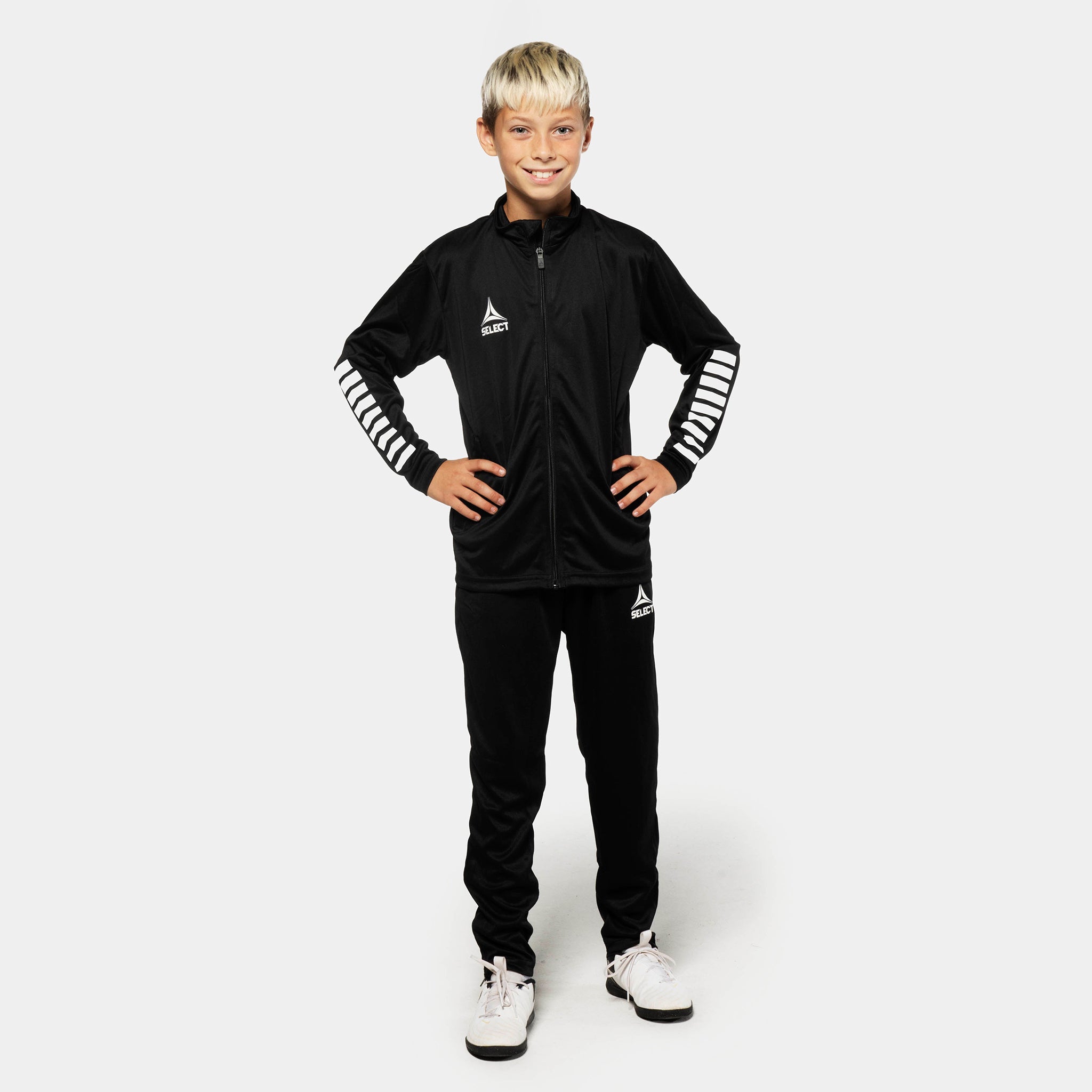 Boy football player in black Training pants regular fit Pisa, Match & Training wear, front view.