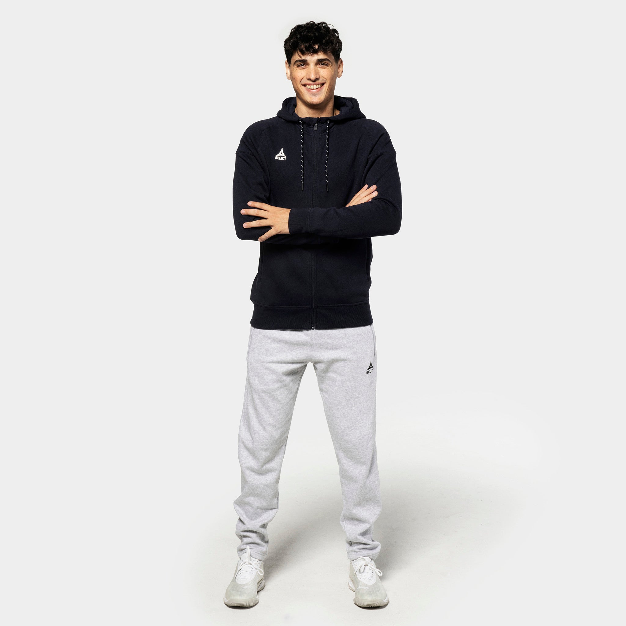 Man in black zip hoodie and grey Sweat pants Oxford v25, leisure wear, front view.