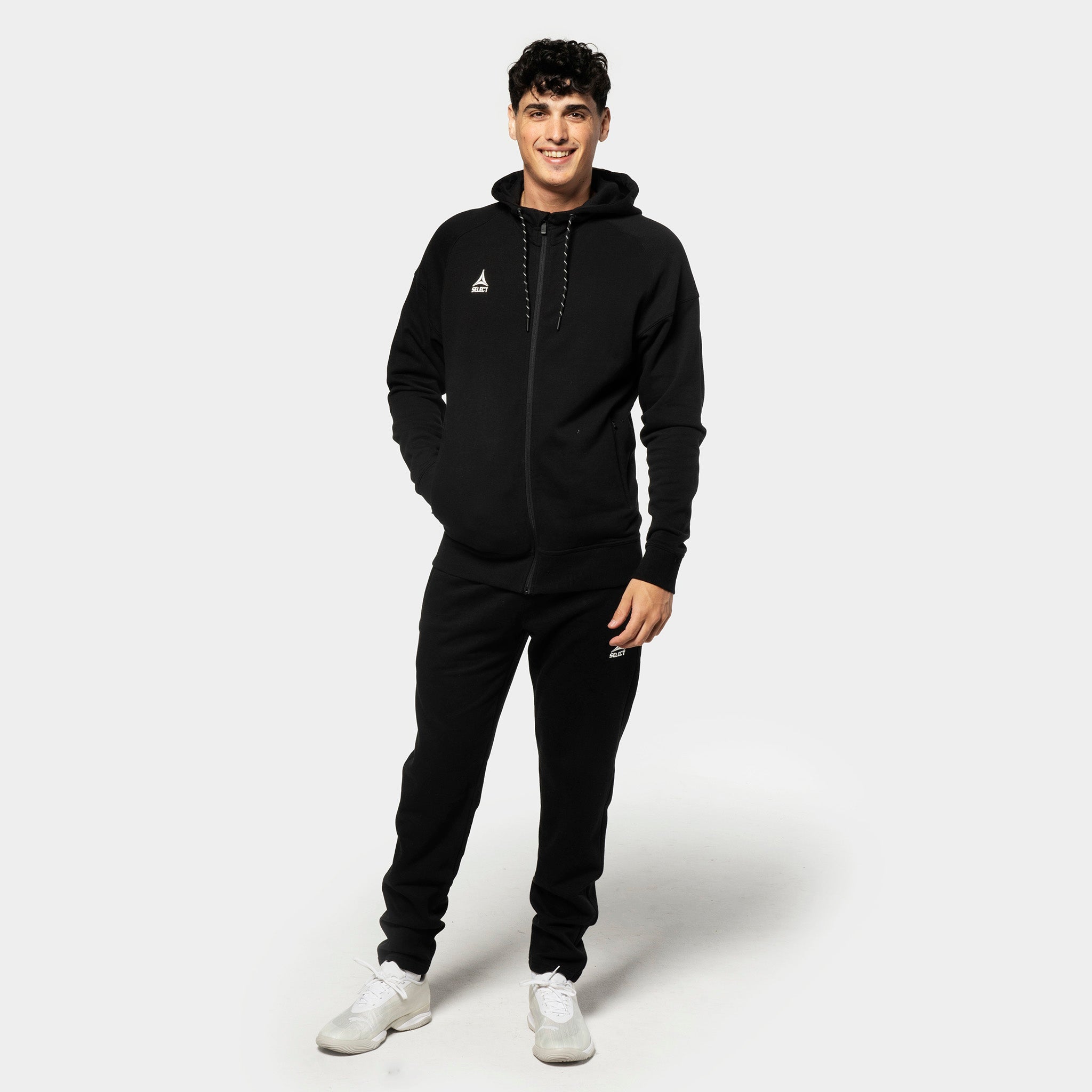 Man football player in black Sweat pants Oxford v25 with matching hoodie, leisure wear, front view.