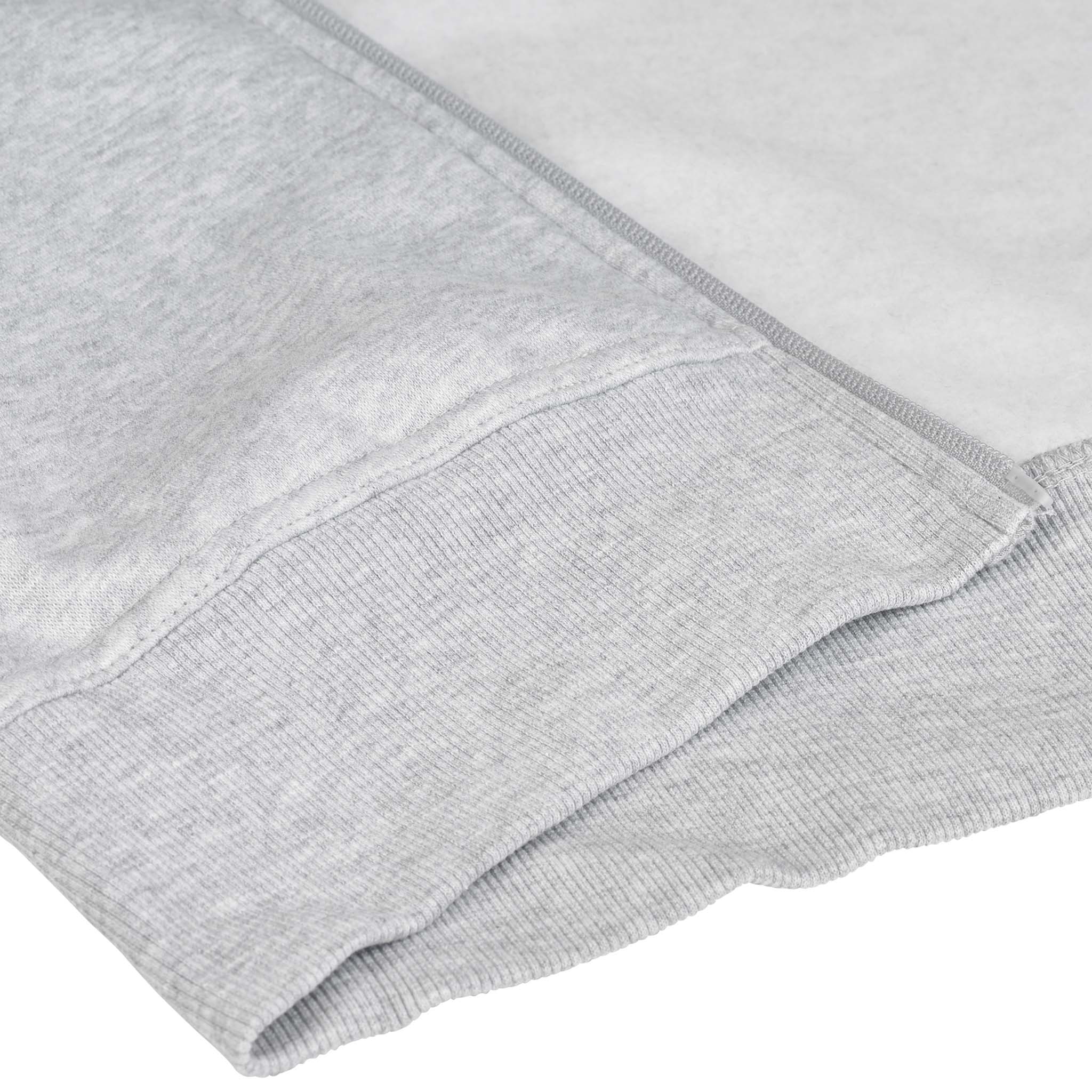 Closeup of grey Zip hoodie Oxford woman v25 leisure wear, showing ribbed cuff and pocket detail