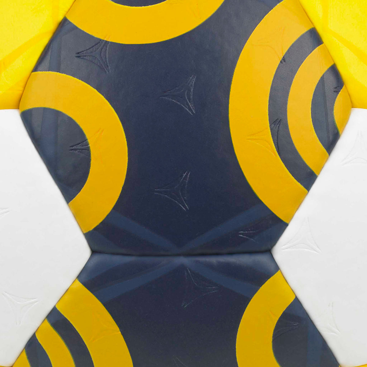Closeup of Replica EHF Euro Women v26 handball, navy panels with yellow swirl patterns and white accents.