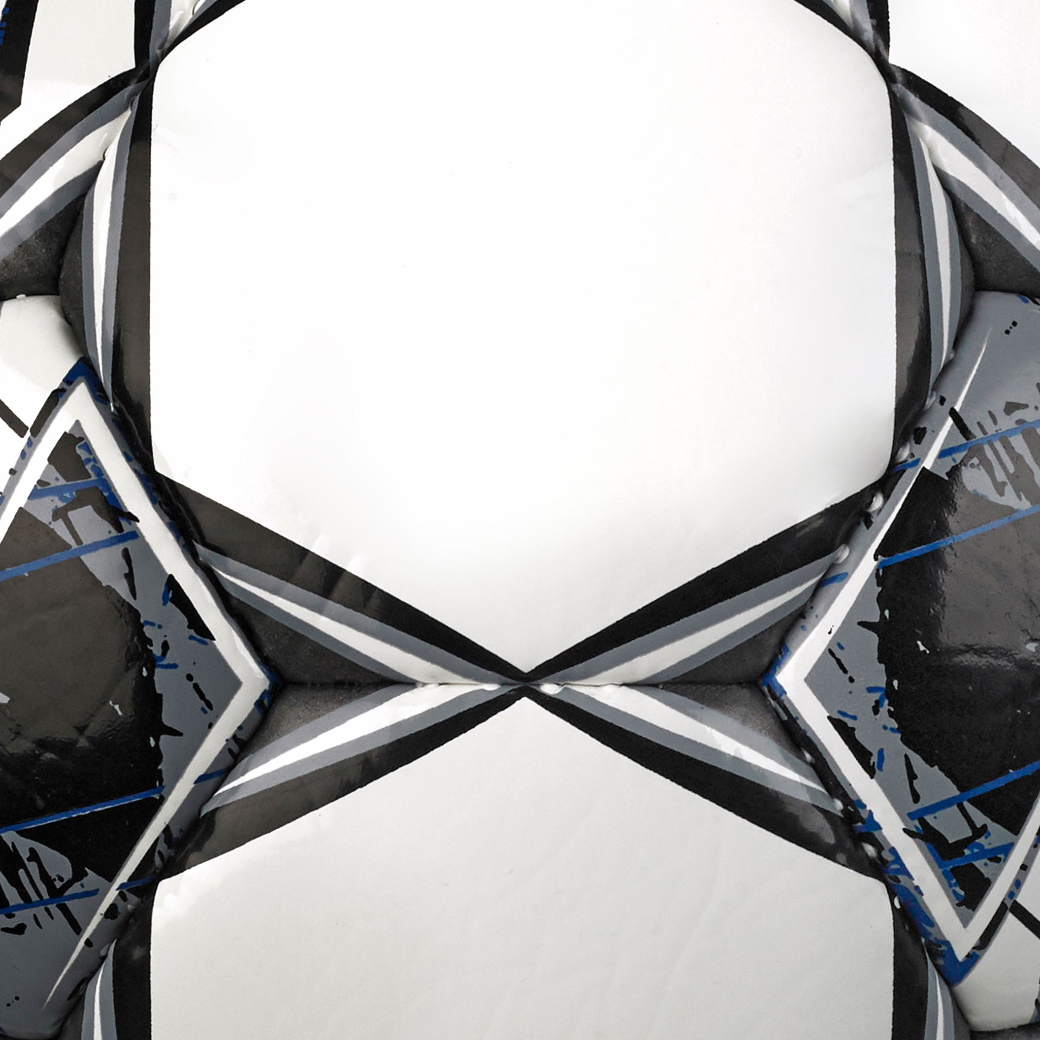 Closeup of Colpo Di Testa v23 football, white surface with black star panels and blue accents.