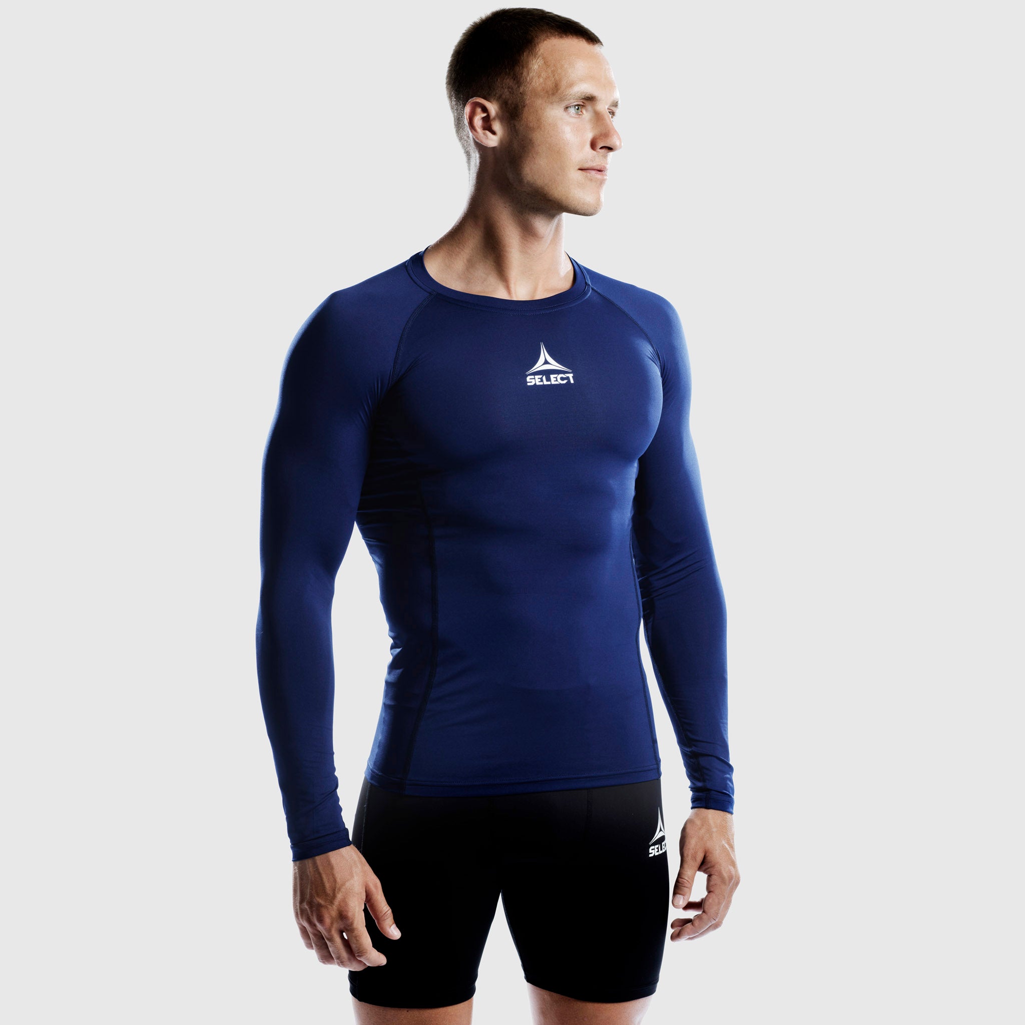 Man football player in navy Shirts L/S Baselayer, front view, fitted long-sleeve baselayer top