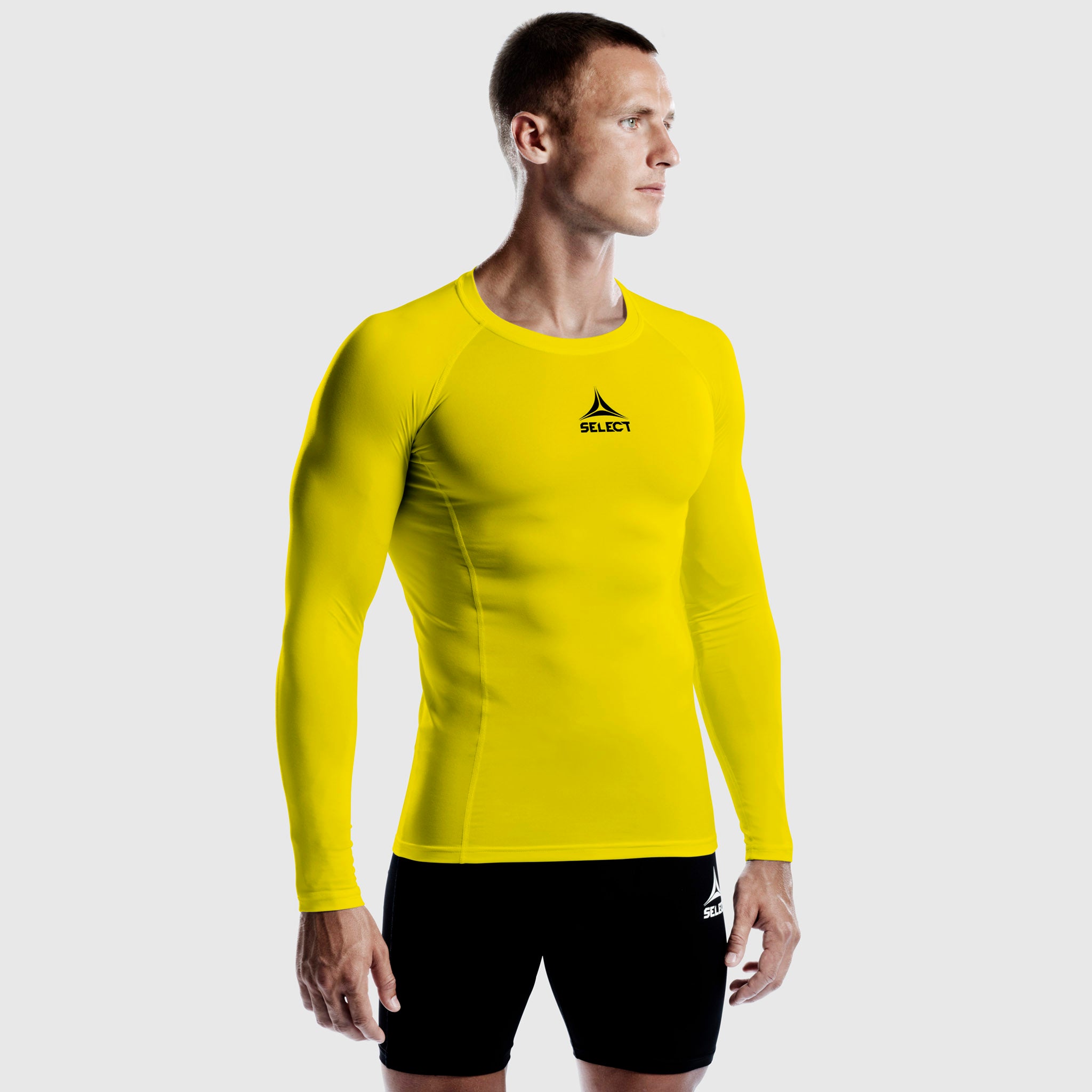 Man football player in yellow Shirts L/S Baselayer, front view