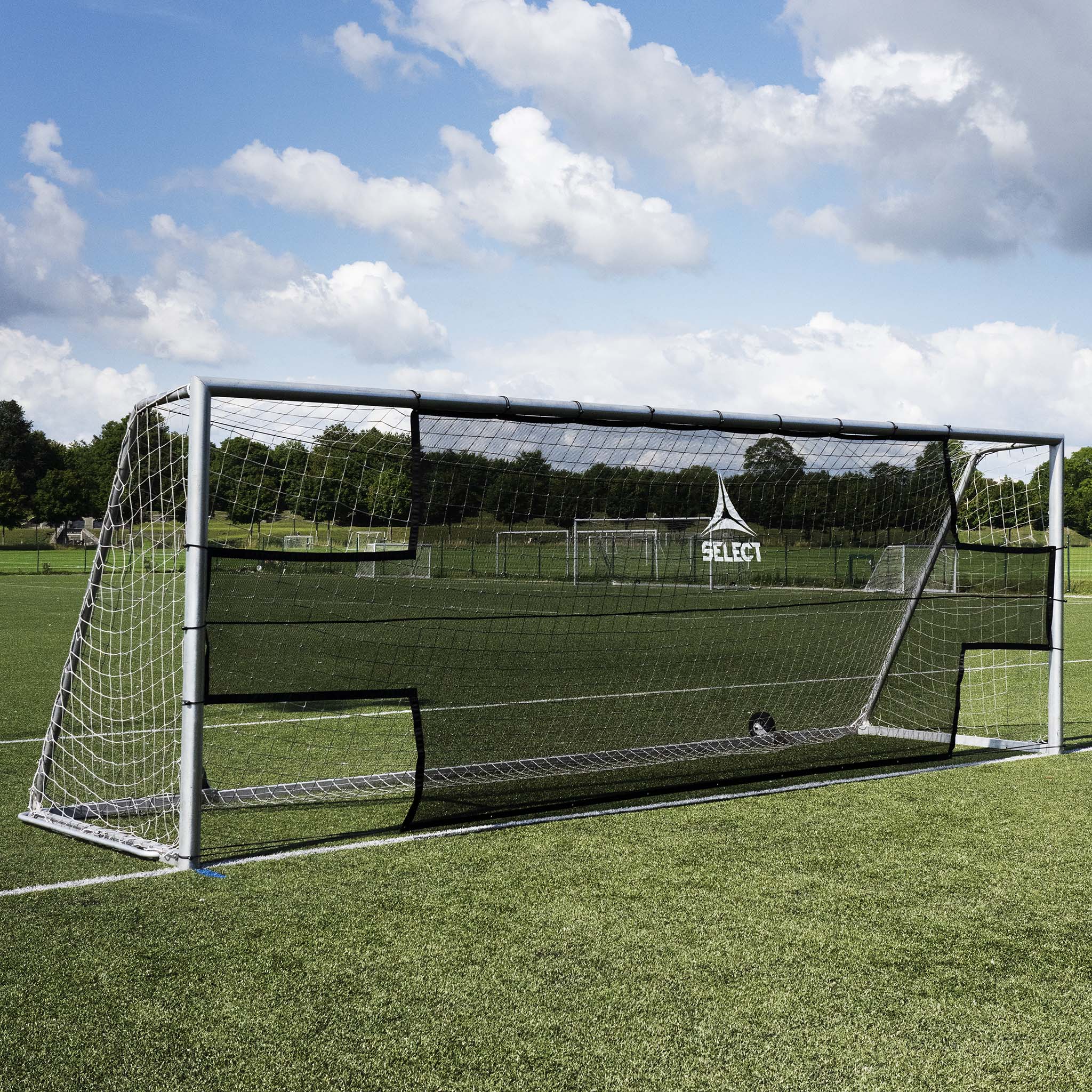 Front page: black and white Goal net football training equipment on a green field