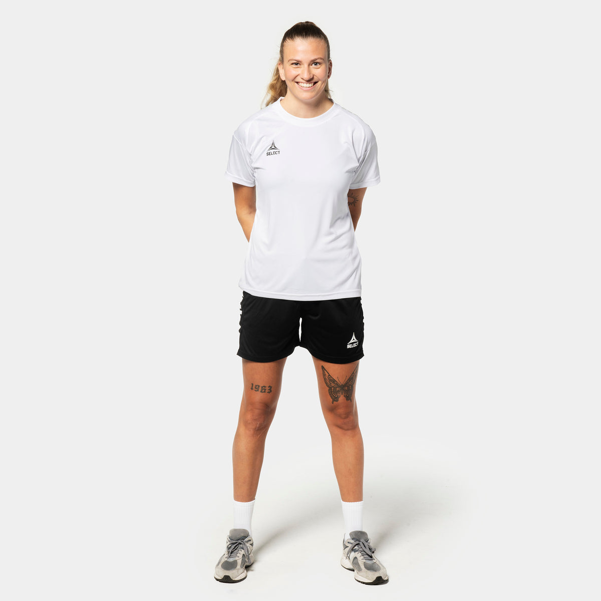 Woman football player in white Player shirt S/S Spain woman v25 and black Player shorts Spain woman v25, Match & Training wear, front.